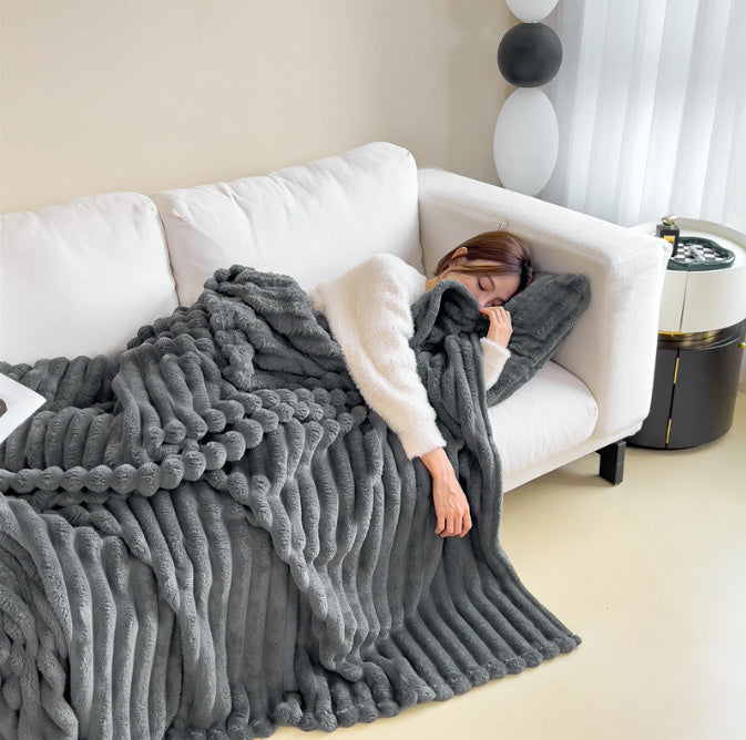 Stijlvolle woondeken van zacht fleece, perfect als plaid op bank of bed; voegt warmte toe aan elk interieur.