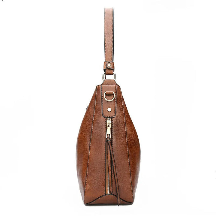 Elegante leren crossbody tas voor dames, een praktisch en stijlvol mode accessoire.