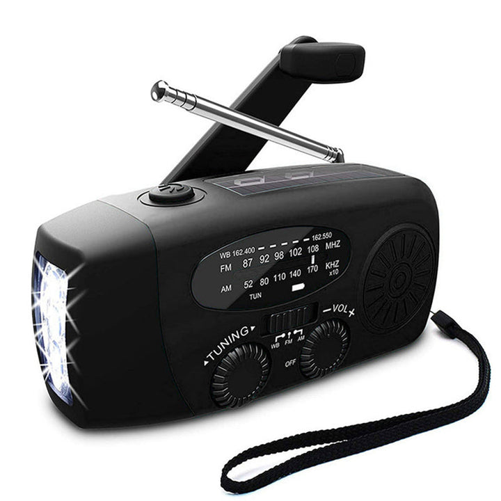 Detailopname van de handopwinder van de zelfaangedreven noodradio, ideaal voor stroom in crisissituaties.