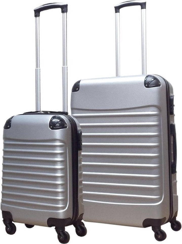 Detail van een zilveren hardshell reiskoffer: stevige telescoopgreep en soepele 360° wielen voor makkelijke bagage.