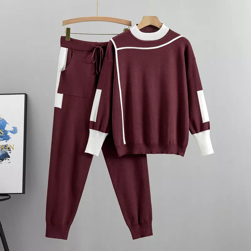 Zwart dames trainingspak, tweedelig. Stijlvolle en comfortabele loungewear, ideaal voor sport of vrije tijd.