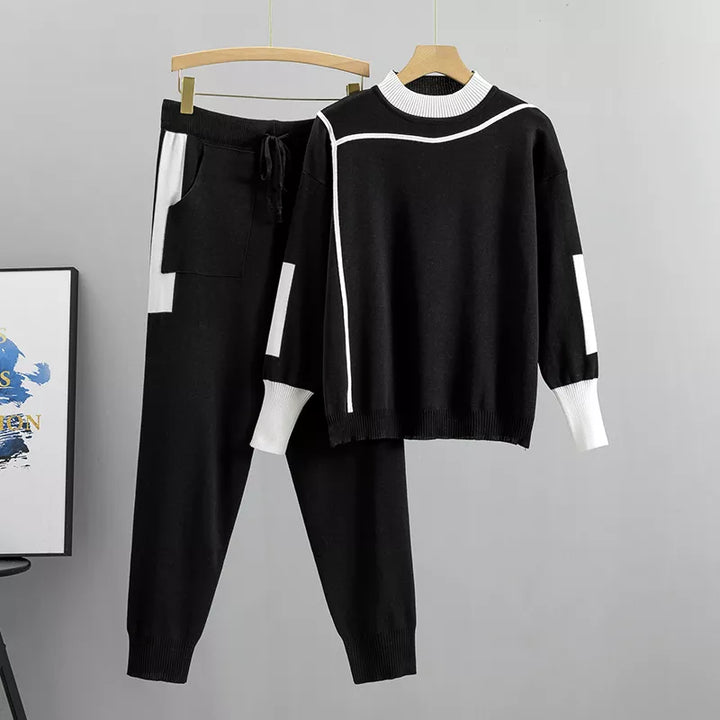 Modern bordeauxrood damespak, perfect als winterkleding of vrijetijdskleding. Comfortabele tweedelige set.