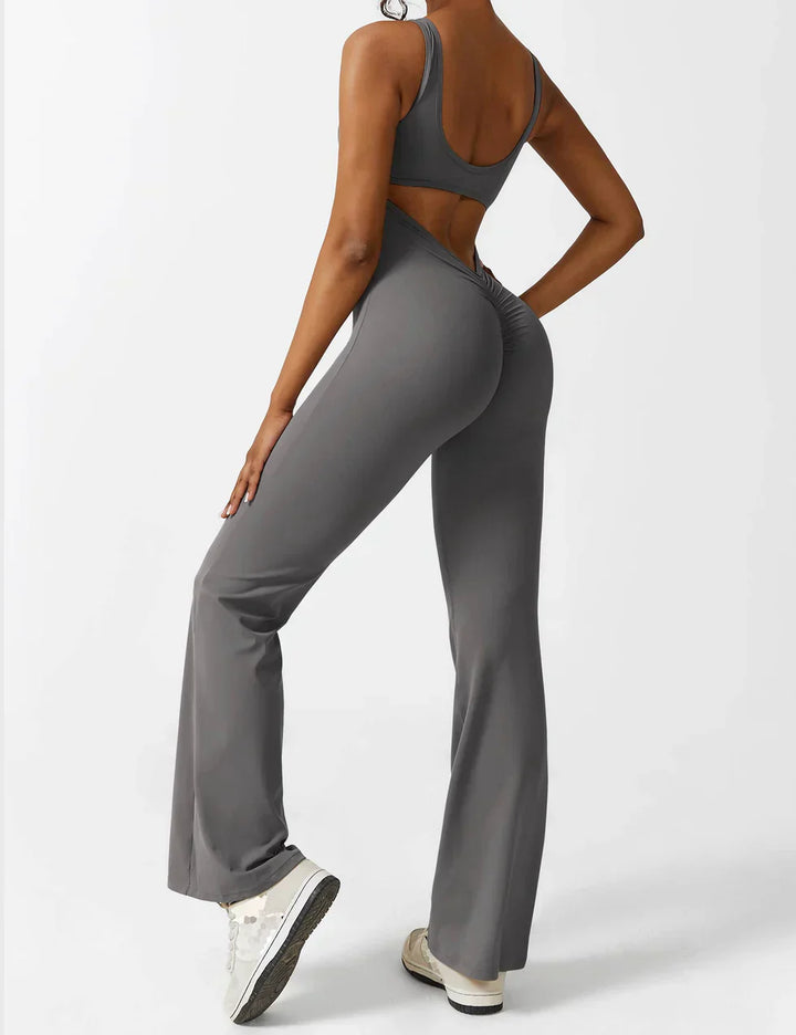 Zwarte stijlvolle jumpsuit dames, flared, shaping effect en modieuze V-rug.