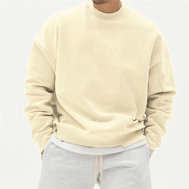 Heren wintertrui met asymmetrische naad, ronde hals. Stijlvolle casual herenkleding voor de koude dagen.