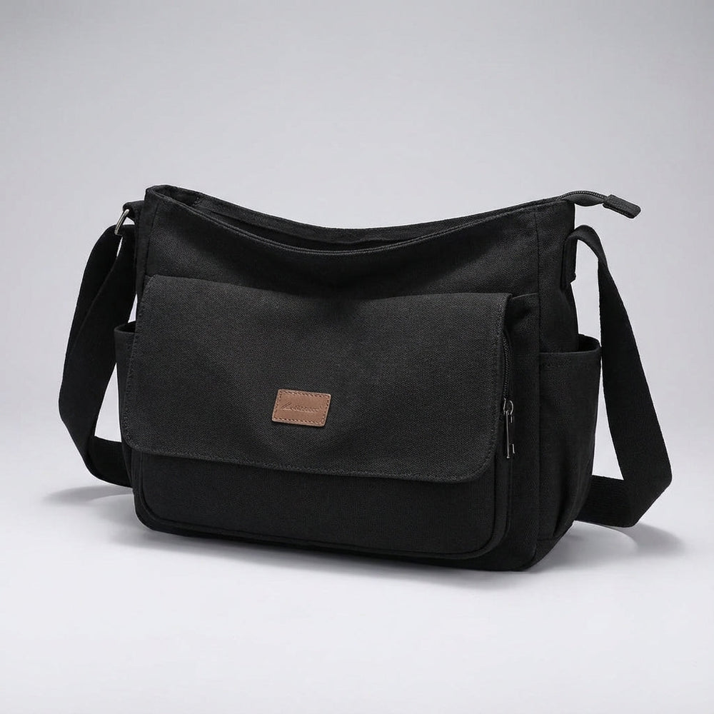 Georganiseerde interieur van de Satchelix laptop schoudertas, met vakken voor 15.6 inch laptop en accessoires.