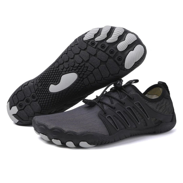 "Zwarte uniseks barefoot schoenen, orthopedisch design, ademend textiel, lichtgewicht, geschikt voor alle seizoenen."
