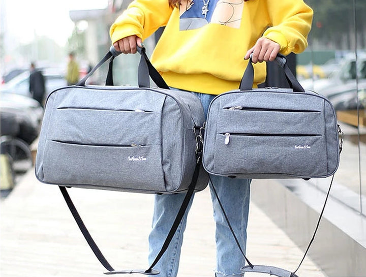 Zwarte unisex handbagage reistas. Compacte draagbare weekendtas voor slim reizen.